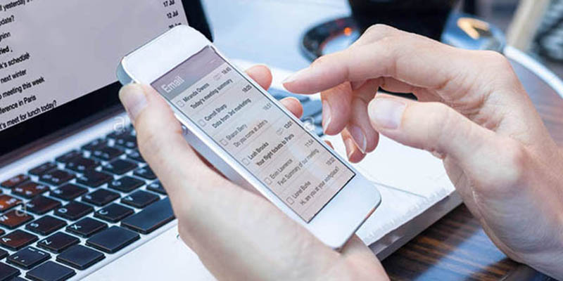 Person booking a class on a phone