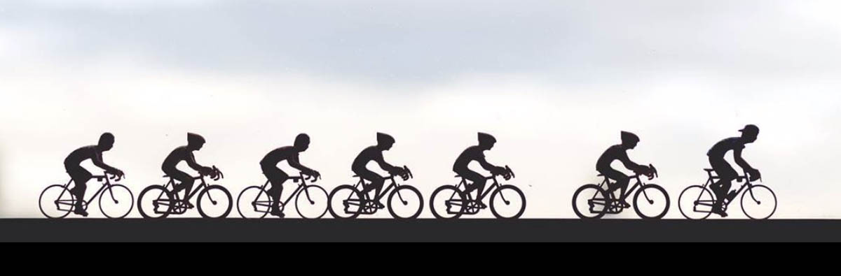 Miniature cyclists on a window sill