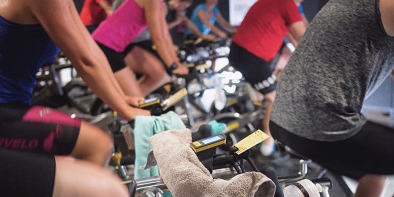 Group of people doing Cycle Collective class
